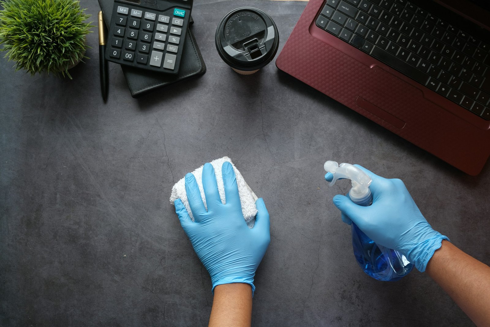 Wiping and disinfecting an office desk